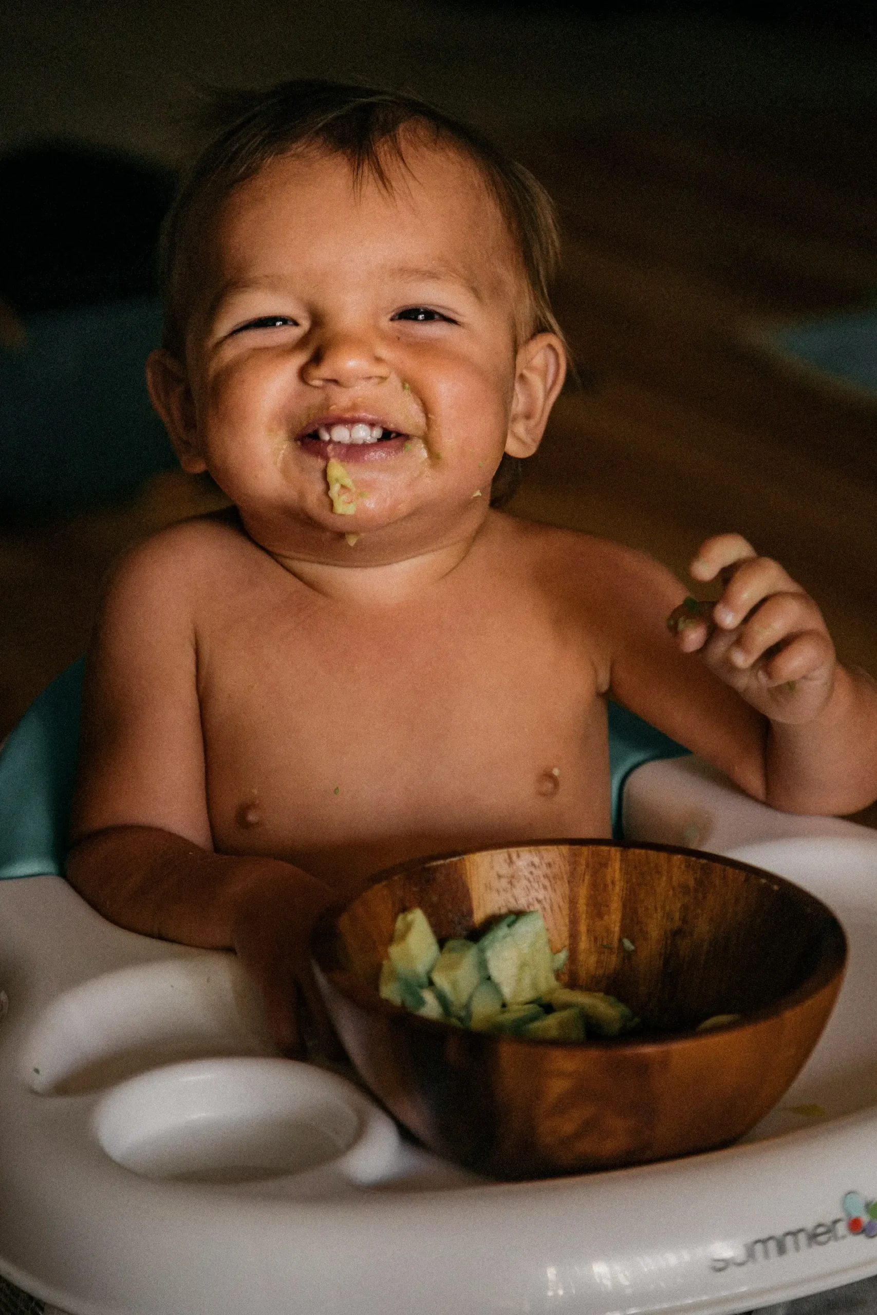 Older baby enjoying solid food